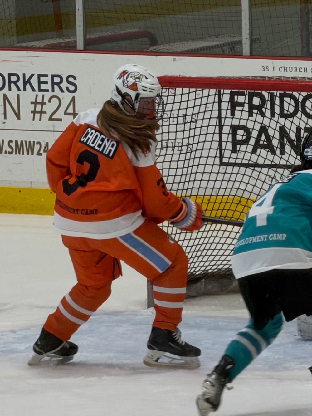 Cameron Cadena, nameplate CADENA and jersey number 3, defending the net front at the 2026 USA Hockey Girls National 15 Player Development Camp