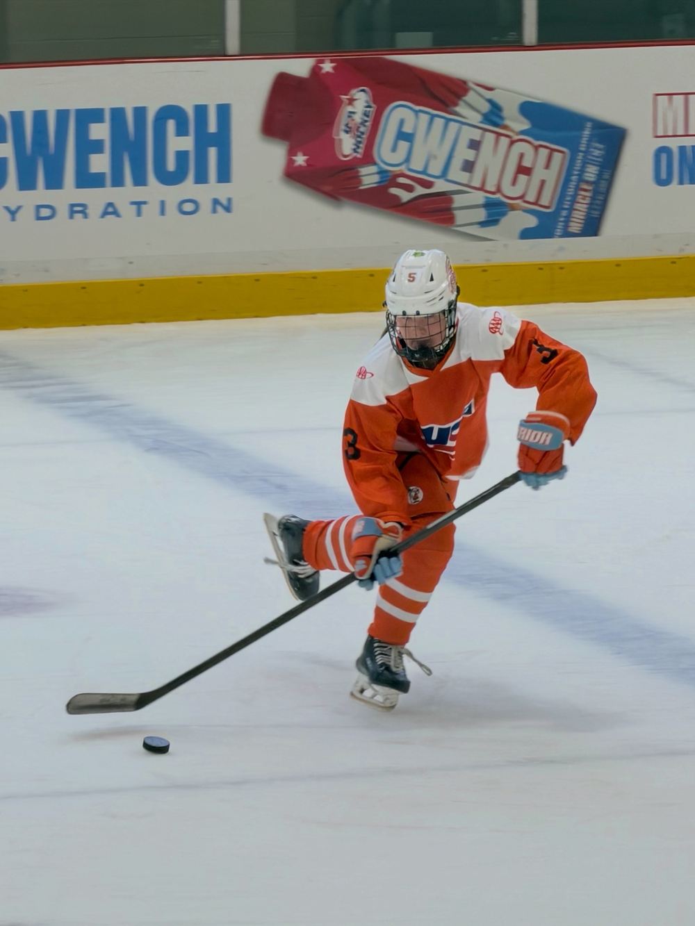 Cameron Cadena skating with the puck in open ice at the Girls National 15 Camp
